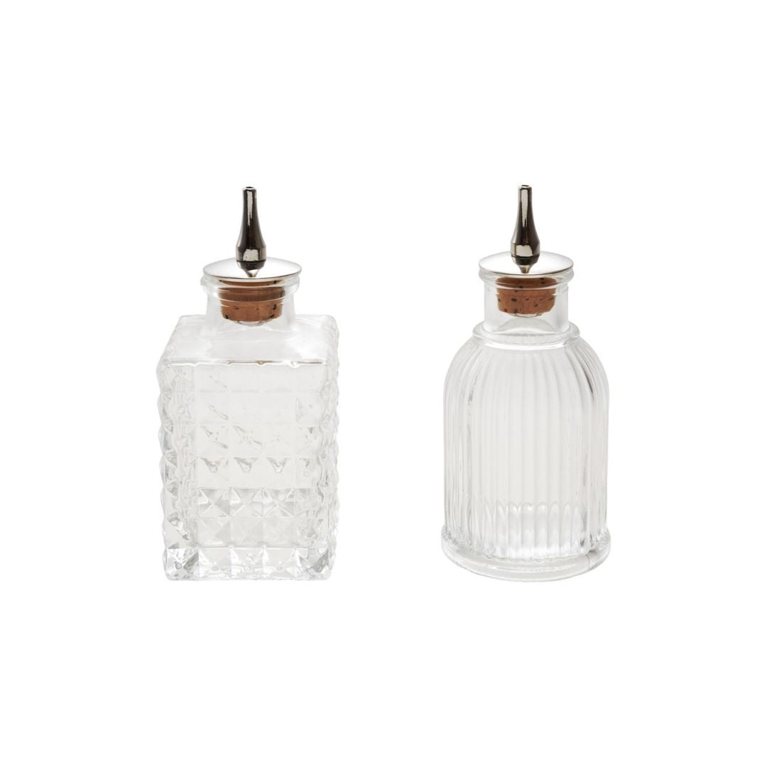 "5""H 2 oz. Glass Bitters Bottle w Cork Stopper, 2 Styles" - CREATIVE COOP - Compralo en CorinneRegalos.com