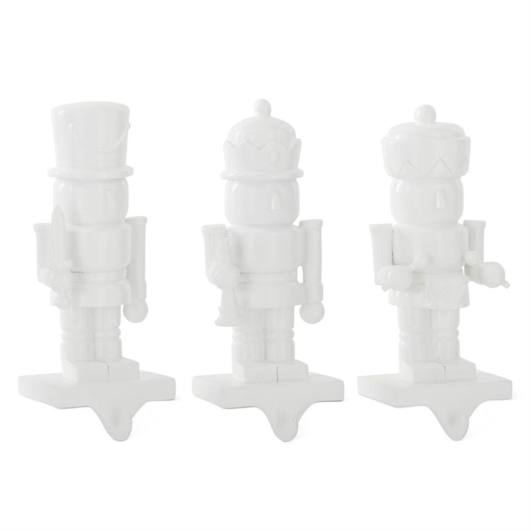 [6/36] | ASSORTED WHITE RESIN NUTCRACKER STOCKING HOLDERS (3