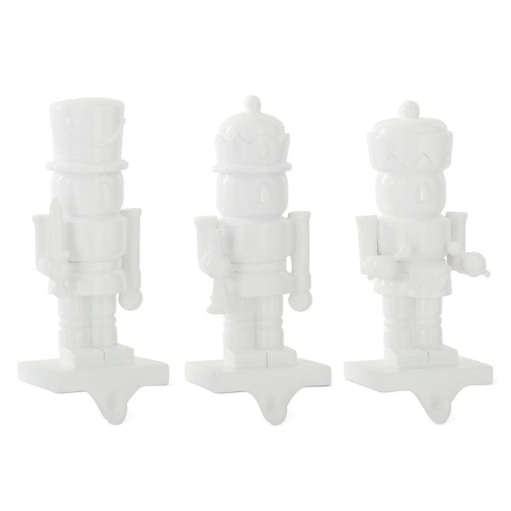 [6/36] | ASSORTED WHITE RESIN NUTCRACKER STOCKING HOLDERS (3